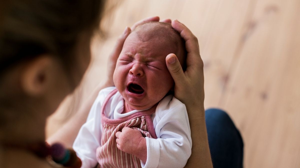 Mother comforting her crying baby